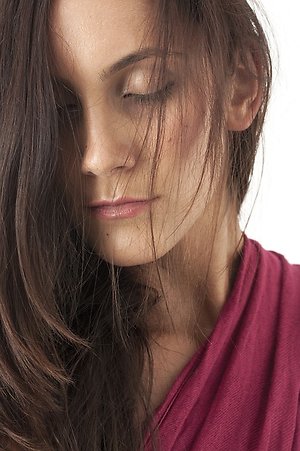 Homeopathy success stories. tired women red dress for blog page